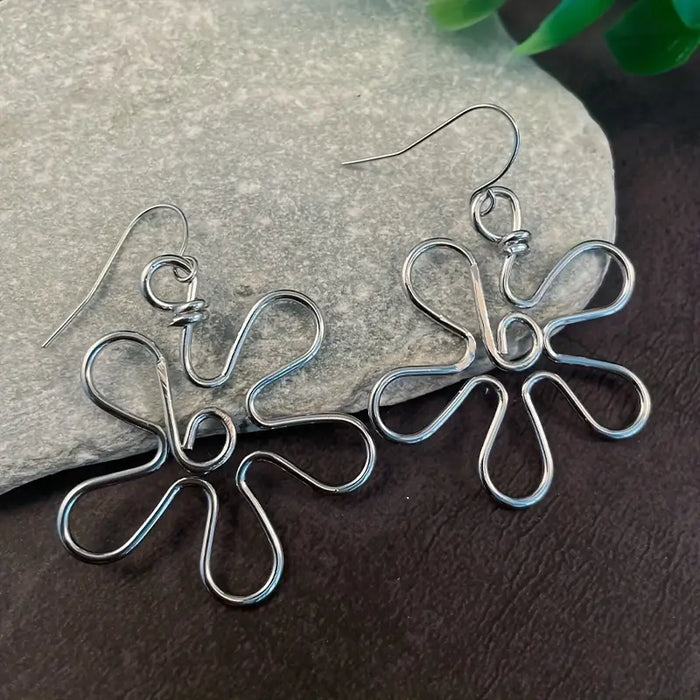 Silver Flower Earrings only at Bling & Bloom's Boutique | Women's Flor Earrings Bling & Bloom's Boutique Silver Flower Earrings Unleash your inner goddess with these dazzling Silver Flower Earrings for a unique and unforgettable accessory! Sparkle with confidence and ad