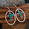 Western Turquoise Cross Earrings only at Bling & Bloom's Boutique | Co Earrings Bling & Bloom's Boutique Western Turquoise Cross Earrings For a daring look that will make a lasting impression, add these Western Turquoise Cross Earrings to your wardrobe! Stand out and ma