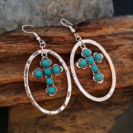 Western Turquoise Cross Earrings only at Bling & Bloom's Boutique | Co Earrings Bling & Bloom's Boutique Western Turquoise Cross Earrings For a daring look that will make a lasting impression, add these Western Turquoise Cross Earrings to your wardrobe! Stand out and ma