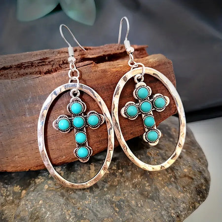 Western Turquoise Cross Earrings only at Bling & Bloom's Boutique | Co Earrings Bling & Bloom's Boutique Western Turquoise Cross Earrings For a daring look that will make a lasting impression, add these Western Turquoise Cross Earrings to your wardrobe! Stand out and ma