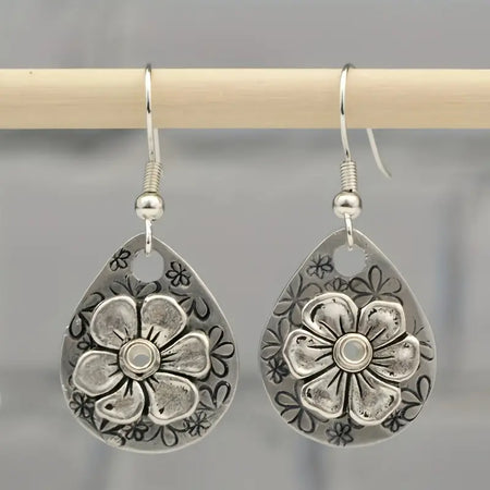 Vintage Engraved Flower Earrings only at Bling & Bloom's Boutique | 3D Earrings Bling & Bloom's Boutique 3D Vintage Engraved Flower Earrings Adorned with intricate details, these earrings make the perfect accessory for any outfit. Dress them up or keep it casual - eithe