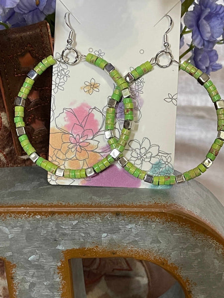 Green Jasper Stone Hoop Earrings only at Bling & Bloom's Boutique | Gr Earrings Bling & Bloom's Boutique Handmade Green Jasper Earrings Large 2-3/8 inch Hoops with Natural Green Imperial Jasper Flat Round Stones and Silver Square Spacers. Set with normal ear hooks, colo