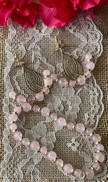 Pink Rose Quartz Earrings |  Pink Stone Bracelet | Etched Gold Charm | Jewelry Sets Bling & Bloom's Boutique Pretty in Pink: This beautiful handmade set of earrings and bracelet are decorated in Rose Quartz Stones with Gold Spacers. These earrings have an etched gold charm 