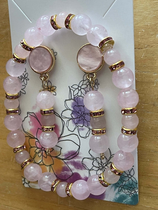 Pink Pearl Flat Stud Earrings | Dangling Rose Quartz | Pink Rhinestone Jewelry Sets Bling & Bloom's Boutique Handmade to impress with Stud Pink Pearl Earrings Dangling with Rose Quartz and Pink Rhinestones and Matching Bracelet. These earrings are outlined in gold to set th