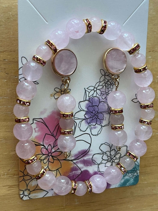 Pink Pearl Flat Stud Earrings | Dangling Rose Quartz | Pink Rhinestone Jewelry Sets Bling & Bloom's Boutique Handmade to impress with Stud Pink Pearl Earrings Dangling with Rose Quartz and Pink Rhinestones and Matching Bracelet. These earrings are outlined in gold to set th